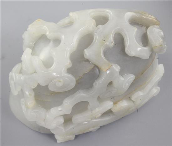 A Chinese greyish-white jade cup or brushwasher, 12cm, wood stand